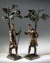 A PAIR OF ORIENTAL 'WATER CARRIERS' SCULPTURES , MARCEL DEBUT