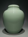 A PAIR OF CHINESE CELADON-GLAZED JARS AND COVERS
