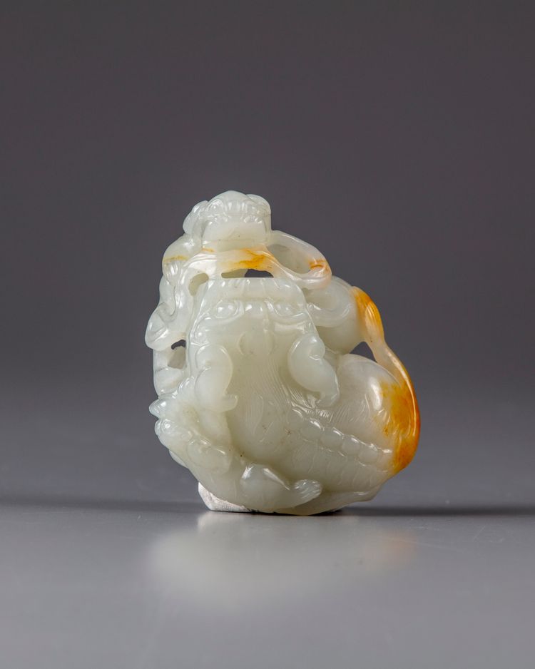 A Chinese white jade ‘Buddhist lion and cubs’ carving