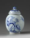 A small Chinese blue and white jar and a cover