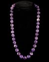 A BEAUTIFUL NECKLACE COMPOSED OF GLOWING PURPLE AMETHYST BEADS,