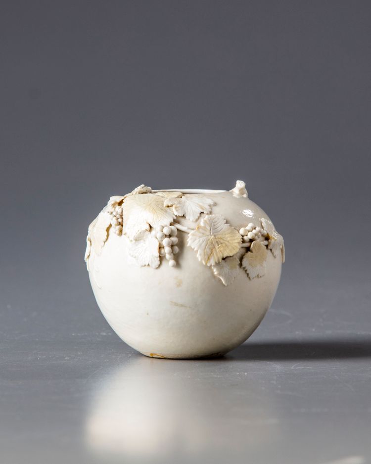 A CHINESE WHITE-GLAZED 'SQUIRREL AND GRAPES' WATER POT