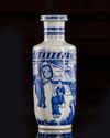 A small Chinese blue and white 'figural' rouleau vase