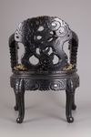 A pair of Chinese hardwood dragon chairs