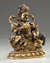 A Sino-Tibetan gilt bronze figure of Jambhala