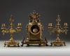 A NEO-RENAISSANCE STYLE BRONZE CLOCK AND CANDLELABRA SET, LATE 19TH CENTURY