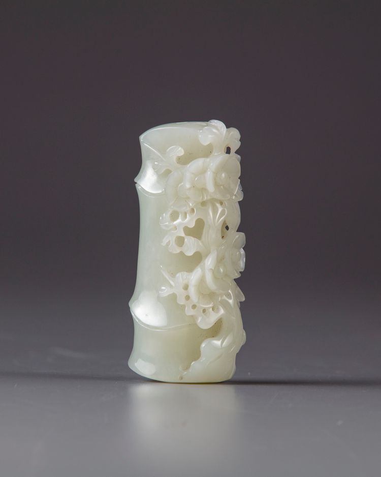 A CHINESE WHITE JADE 'PRUNUS AND BAMBOO' CARVING, 20TH CENTURY