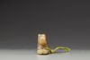 A celadon and russet jade carving of a hound