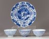 A group of four blue and white objects