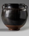 A Chinese brown-glazed ribbed jar