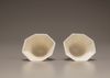 A pair of white-glazed octagonal 'prunus' cups