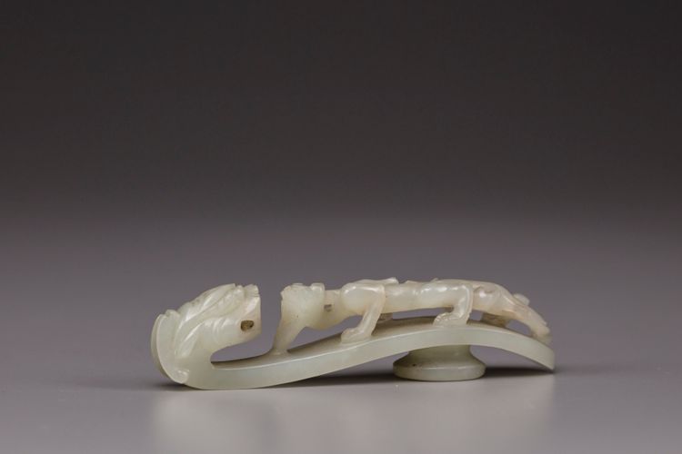 A pale celadon jade belt hook