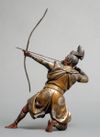 A bronze figure of a Samurai warrior resting on one knee while tensioning a bow