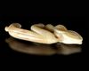 A CREAMY WHITE JADE CARVING OF AN EMBRYONIC MYTHICAL ANIMAL, CHINA, HONGSHAN CULTURE