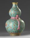 A Chinese turquoise-ground famille rose double gourd vase
