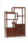 A small Chinese hardwood ‘dragon’ display cabinet