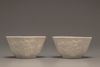 A pair of white-glazed lobed cups