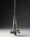 A BYZANTINE FOUR SPOUTED LAMP, 6TH-7TH CENTURY AD
