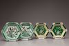 Two pairs of hexagonal biscuit porcelain sweetmeat dishes