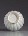 A CHINESE WHITE GLAZED LOBED VASE, QING DYNASTY (1644-1911)