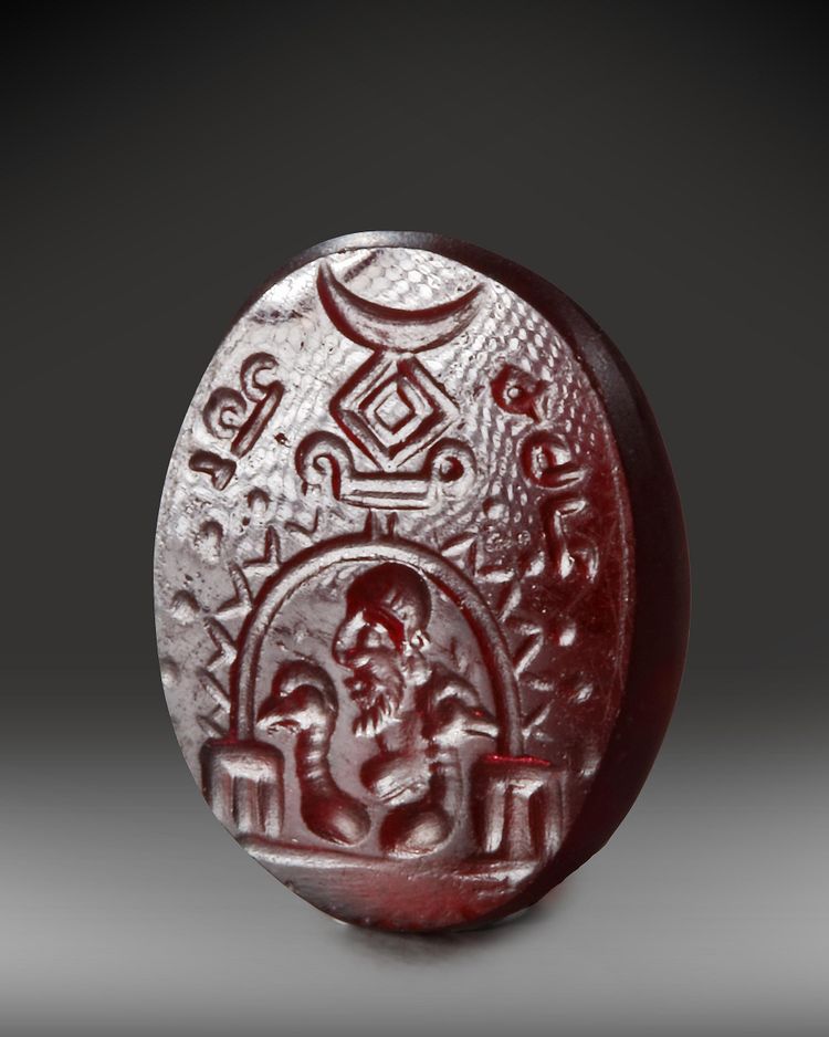 A SASSANIAN GARNET INTAGLIO, CIRCA 3RD-5TH CENTURY A.D.