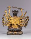 A MULTI-ARMED GILT CHINESE BRONZE FIGURE OF GUANYIN