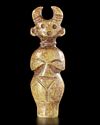A GREENISH-YELLOW JADE CARVING OF A HORNED STANDING FIGURE, CHINA, HONGSHAN CULTURE