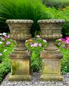 A PAIR OF CARVED LIMESTONE PLANTERS, 20TH CENTURY