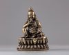 A bronze seated figure