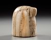 A NISHAPUR IVORY CHESS PIECE, PERSIA, 11TH-12TH CENTURY