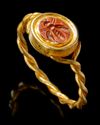 A ROMAN RED JASPER INTAGLIO OF A BEE WITH GOLD RING, CIRCA 1ST-2ND CENTURY A.D.