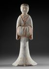 A LARGE TERRACOTTA STATUE OF A STANDING FEMALE ATTENDANT, CHINA, HAN DYNASTY (206 BC-206 AD)