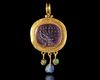 A LATE ROMAN–BYZANTINE GOLD PENDANT WITH AMETHYST MENORAH INTAGLIO, 5TH-7TH CENTURY AD