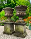 A PAIR OF CARVED LIMESTONE PLANTERS, 20TH CENTURY