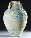 A POST SASSANIAN TURQUOISE GLAZED POTTERY STORAGE JAR, PERSIA OR IRAQ, 7TH-8TH CENTURY