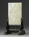 A CHINESE CELADON JADE 'GUANYIN' TABLE SCREEN, QING DYNASTY (1644-1911)