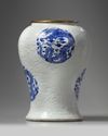 A rare Chinese moulded white-ground blue and white 'dragon' vase