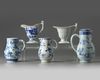 A GROUP OF FIVE CHINESE BLUE AND WHITE AND EN GRISAILLE POURING VESSELS