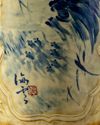 A creme ground blue and white vase