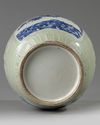 A Chinese celadon-ground blue and white moulded vase