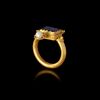 A GOLD RING WITH A BLUE GLASS INLAY, 1ST CENTURY AD OR LATER