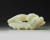 A large Chinese white jade ‘squirrel and grapes’ carving