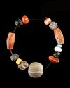 A CARNELIAN AND BANDED AGATE BEAD BRACELET WITH ENGRAVED SEAL