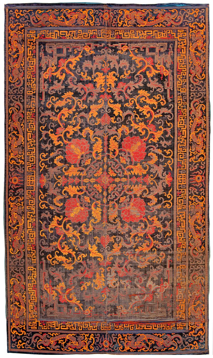 A RARE CHINESE CARPET WITH DRAGONS AND LOTUS, LATE MING DYNASTY