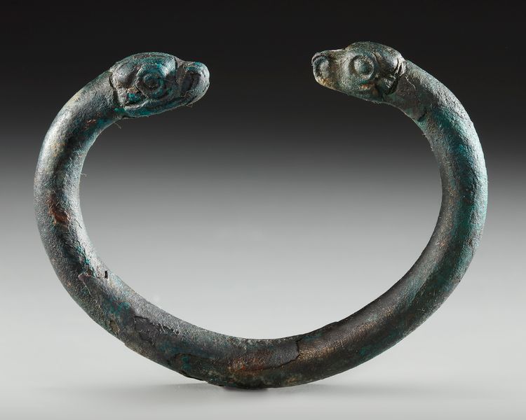 AN URARTIAN BRONZE BRACELET WITH DECORATED FINIALS, CIRCA 9TH-6TH CENTURY B.C.