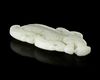 A CHINESE WHITE JADE BUDDHIST LION PENDANT, 20TH CENTURY