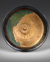 AN ACHAEMENID BRONZE LOTUS PHIALE, CIRCA 6TH-5TH CENTURY B.C.