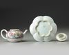 A CHINESE PINK-GROUND FAMILLE ROSE MOULDED 'CHRYSANTHEMUM' TEAPOT, COVER AND STAND