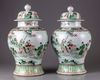 A pair of famille verte vases with cover