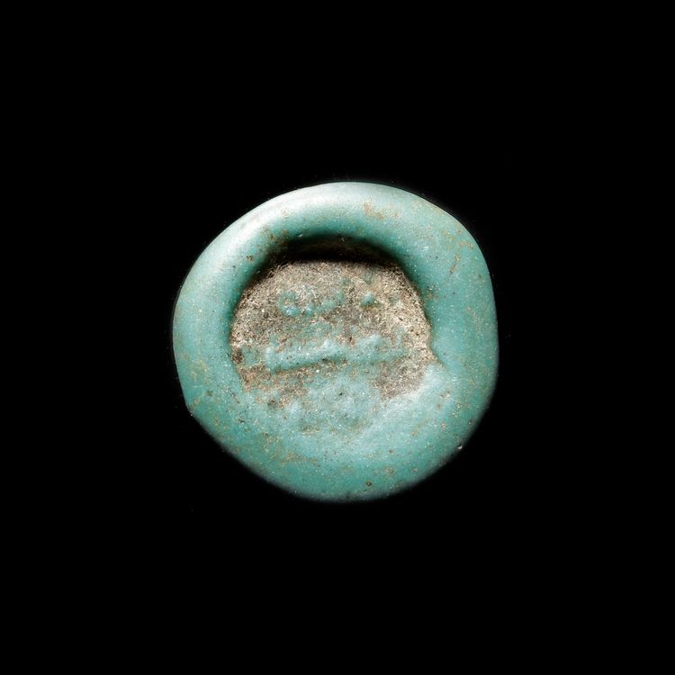 A FATIMID GLASS WEIGHT OF DOUBLE DINAR, EGYPT AL-MUSTANSIR BI-ALLAH (AH 427-487 / 1036-1094 AD),